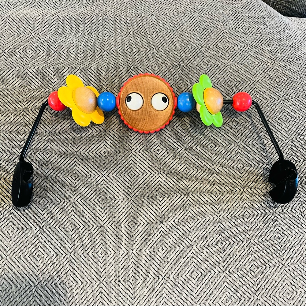 BabyBjorn bouncer wooden toy bar